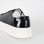 Chanel Low-Top Platform Sneakers – Black Patent Leather with Gold CC Lace Charm
